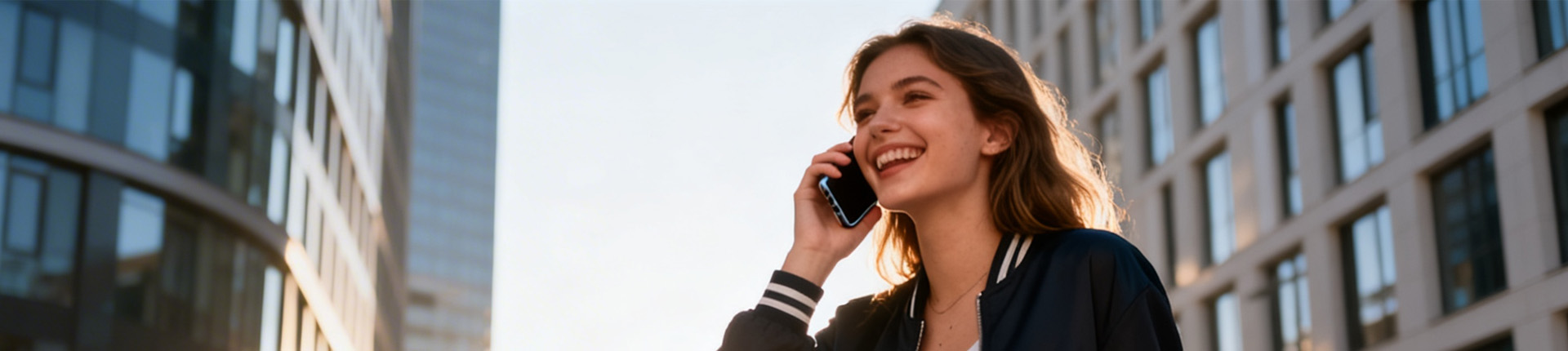 Woman talking on phone outdoors.