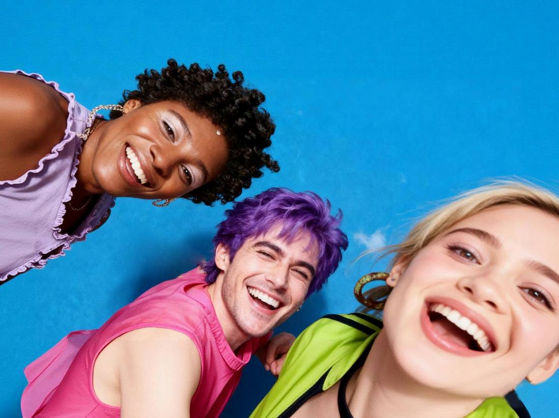 Three friends laughing together